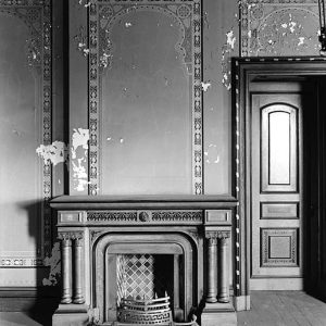 Tiled fireplace and matching Art Nouveau stenciled wall decoration