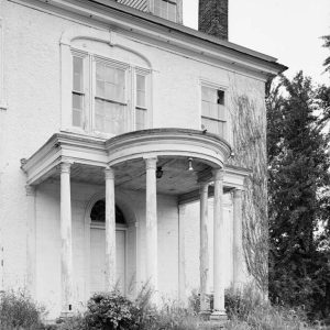 Porch with hooded roof