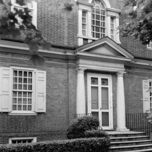 Entry door Doric pilasters and Palladian window